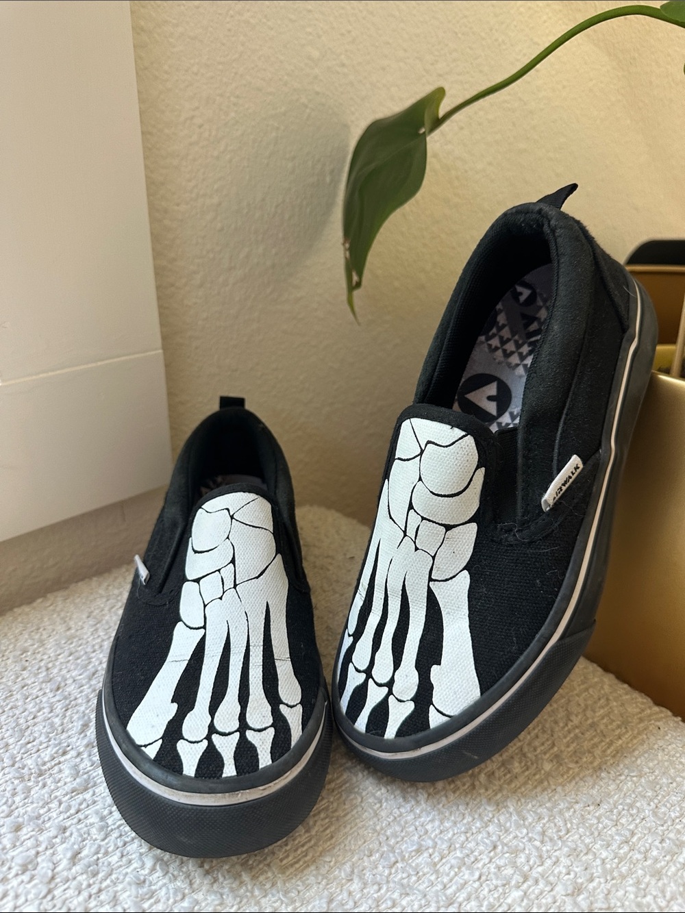 Airwalk Kids Black Slip-On Sneakers with White Skeleton Foot Print